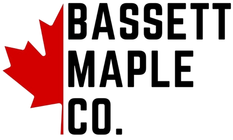 Bassett Maple Co. logo with a red maple leaf on a white background